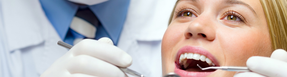 dentist working on smiling patient